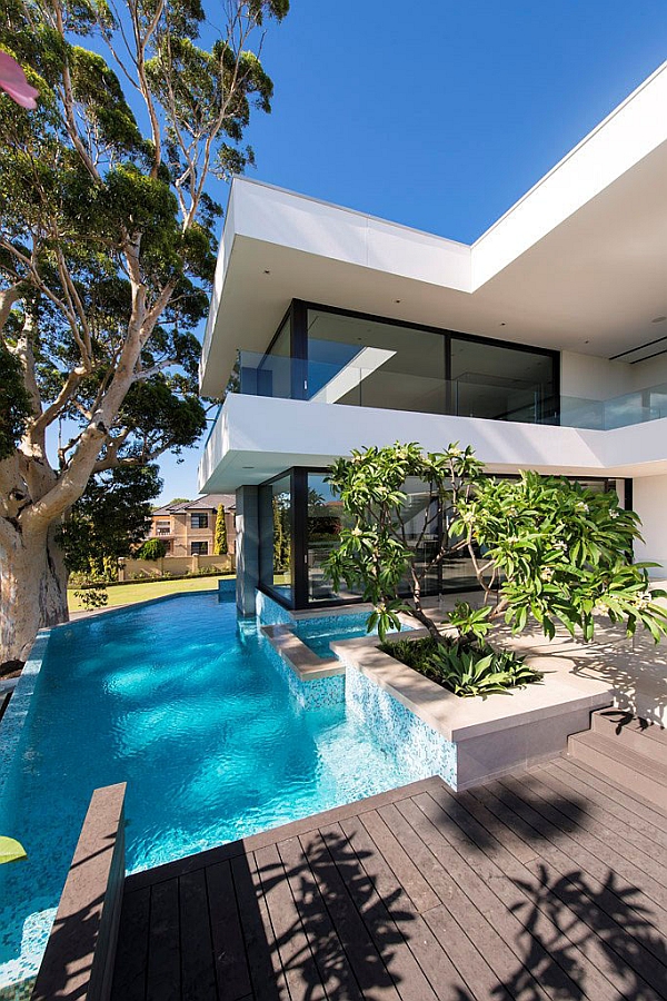 Simple wooden deck next to the pool offers ample privacy