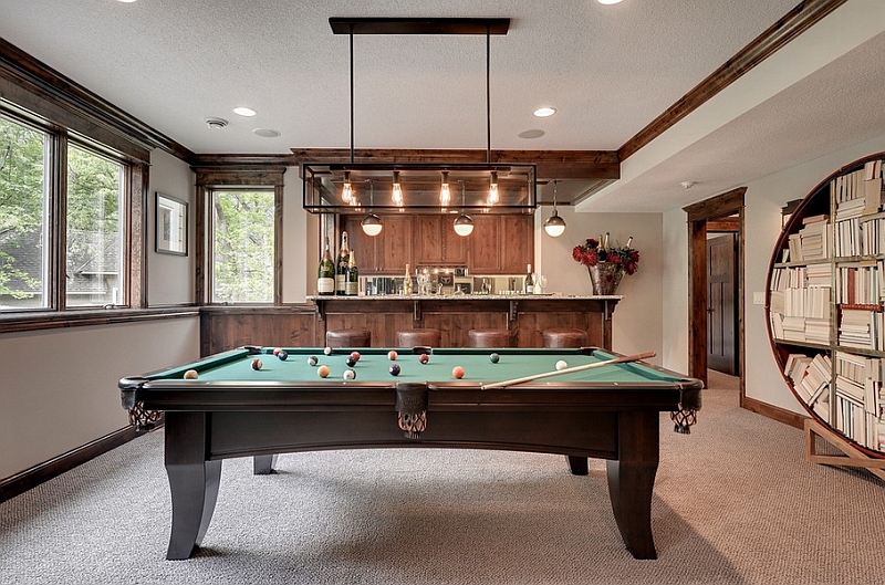 Small Hicks pendants enliven the backdrop in this family room