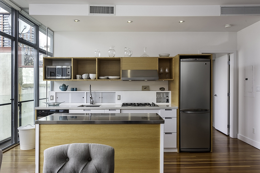 Small and ergonomic modern kitchen with wooden cabinets and a white countertop