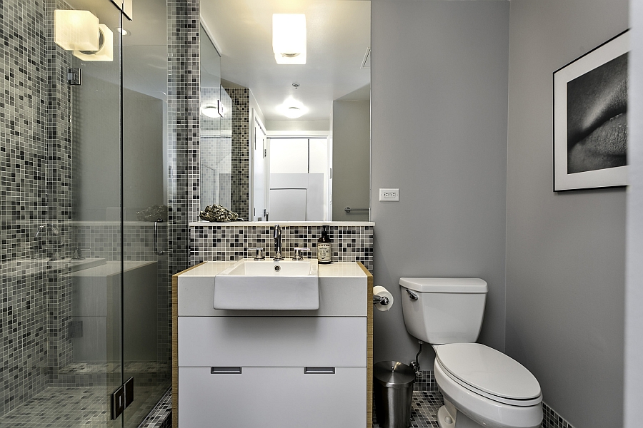 Small bathroom with a glass shower area and a beautiful vanity