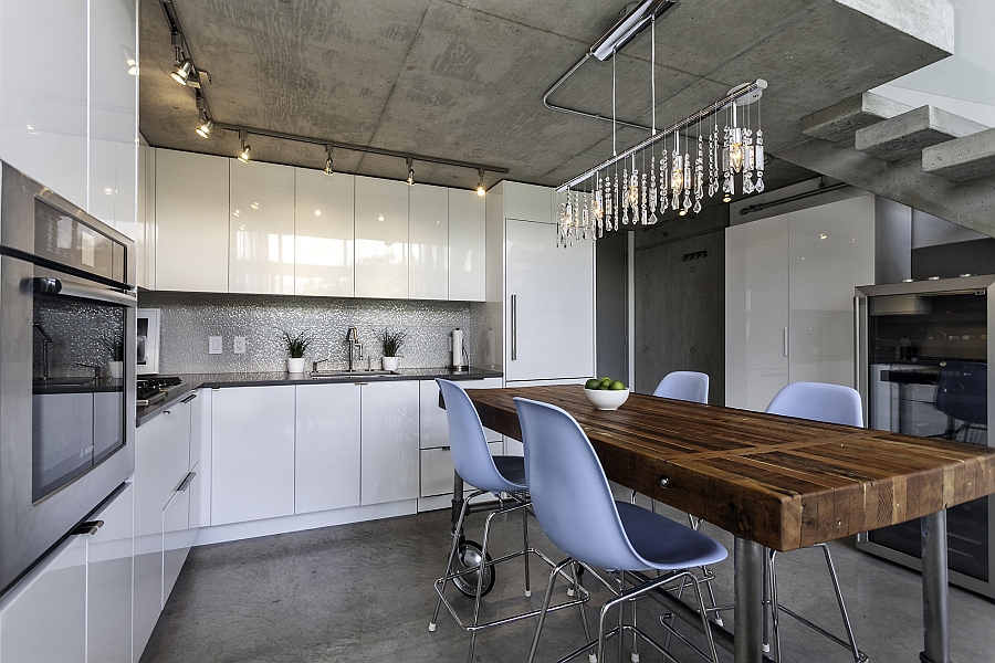 Smart cascading chandelier above the dining space enlivens the kitchen