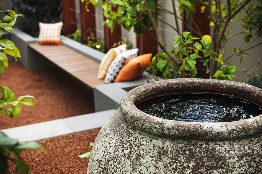 Soothing private patio with decorative additions that borrow from the rustic