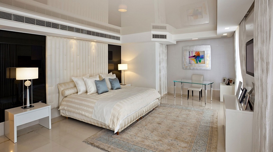 Spacious contemporary bedroom in black, white and cream