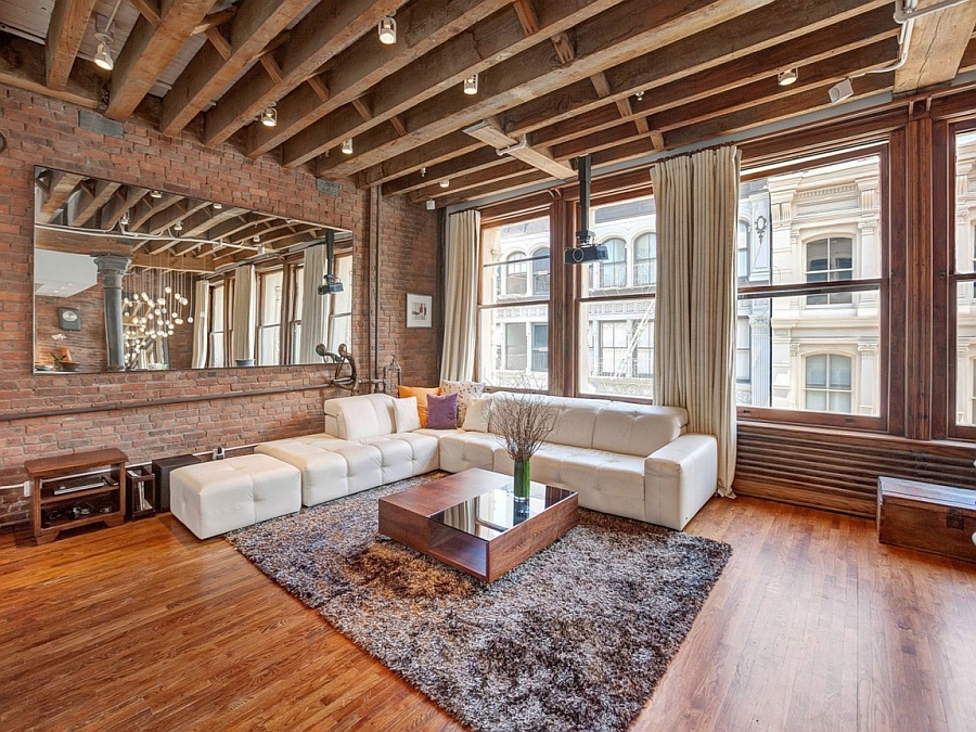 Spacious Living Room Of The NYC Loft In Wood And Brick 