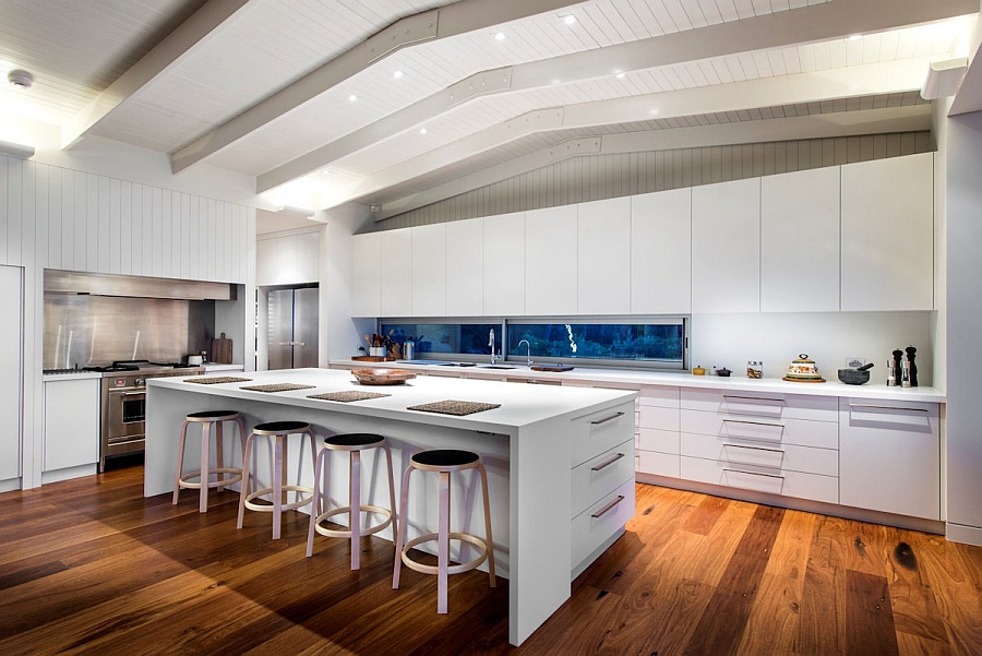 Spacious modern kitchen in white with an elegant serving area