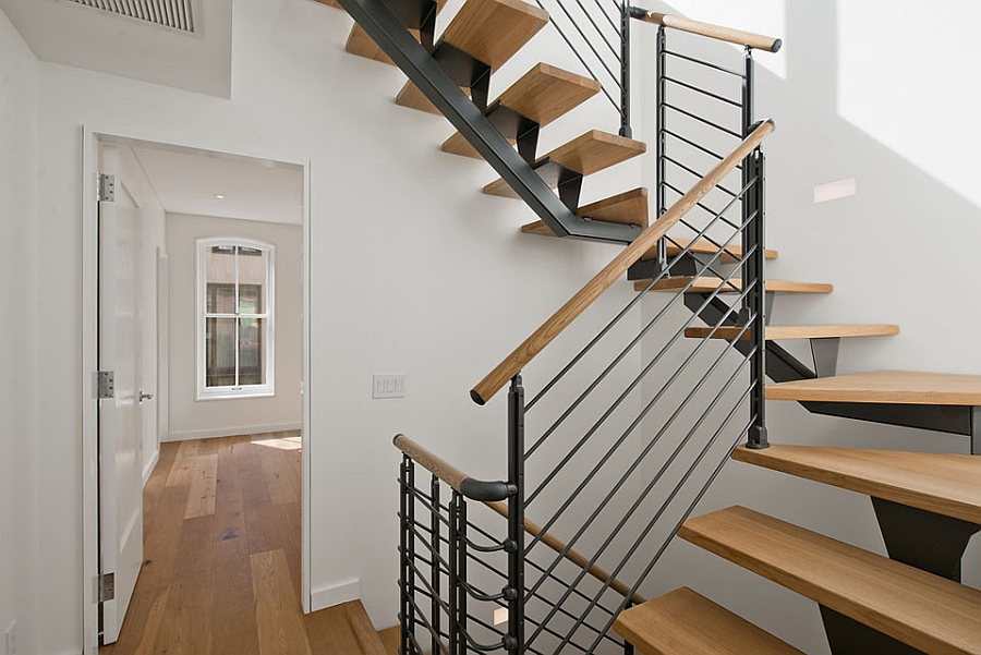 Strategically placed staircase adds to the visual height of the rooms