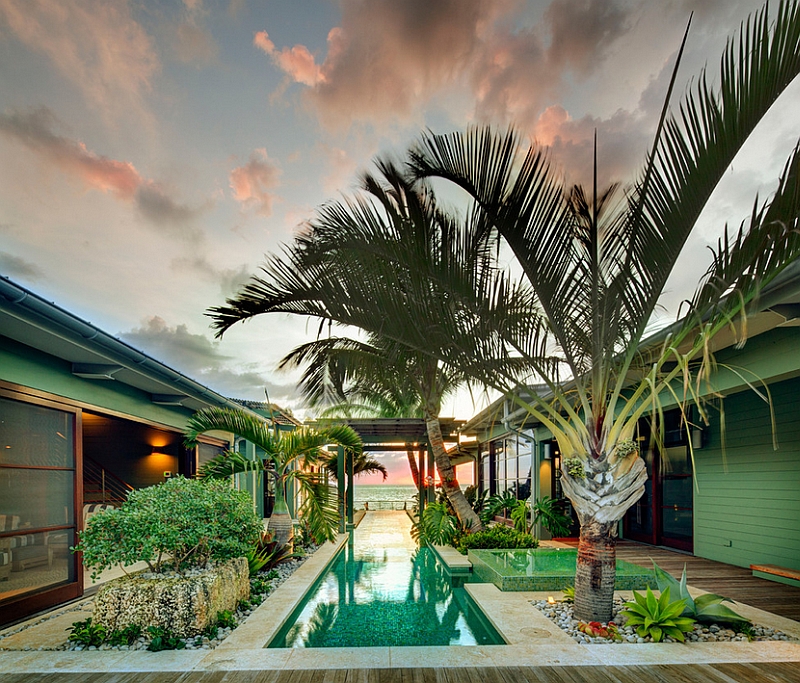 Stunning glass bottom pool and a tropical vibe give the pool deck an exotic appeal