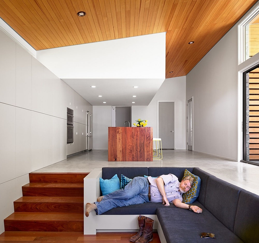 Sunken living space with a cozy couch allows you to relax in peace