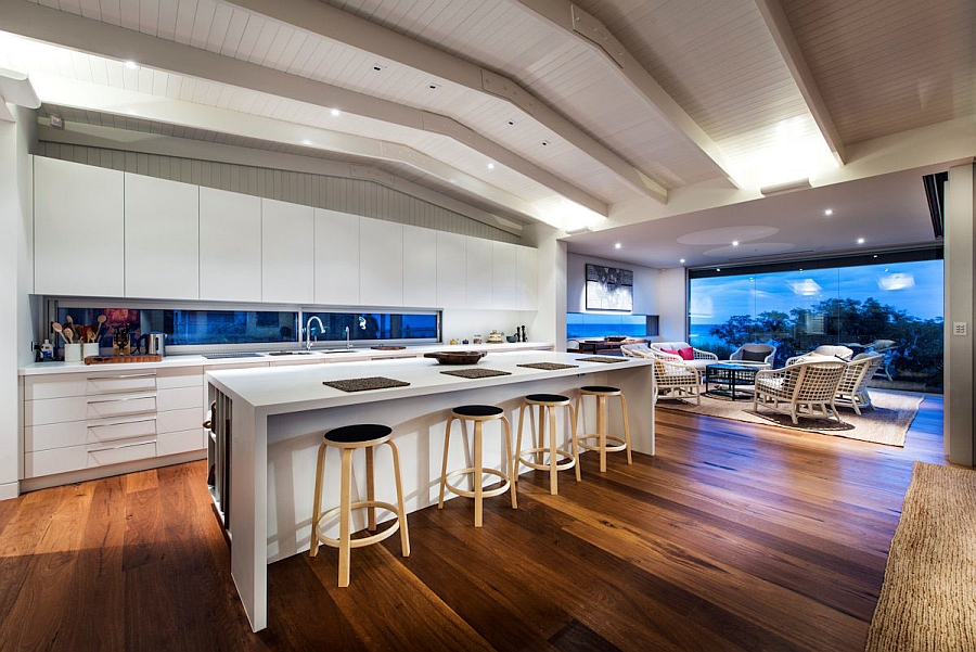 Trendy kitchen in white with a casual beach style