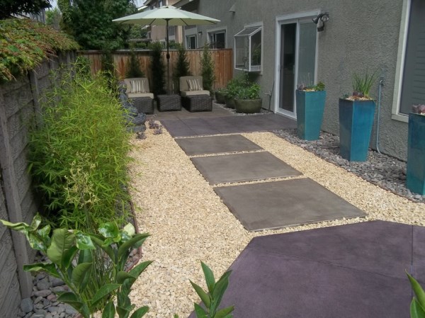 Turquoise planters in an outdoor lounge area