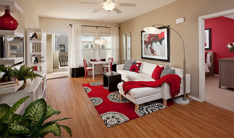 White combined with black and red to make the living room more pleasant