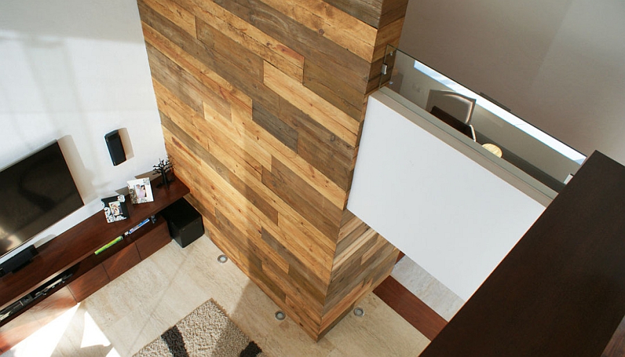Wooden accent wall in the living room adds textural contrast
