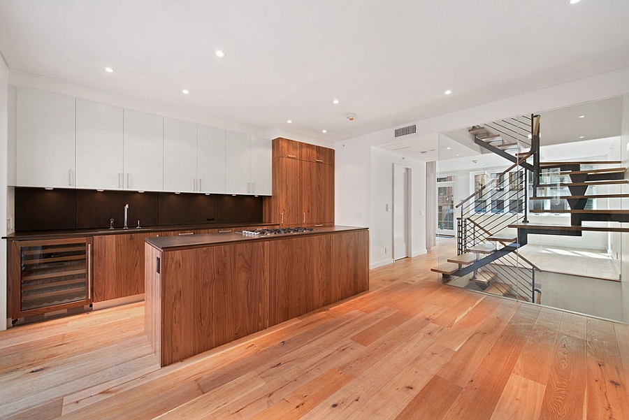 Wooden kitchen island adds a touch of inviting warmth to the residence