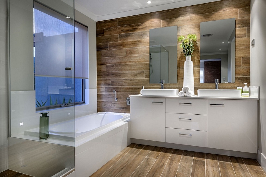 Wooden panel flooring and walls give the spa-like bath an inviting appeal