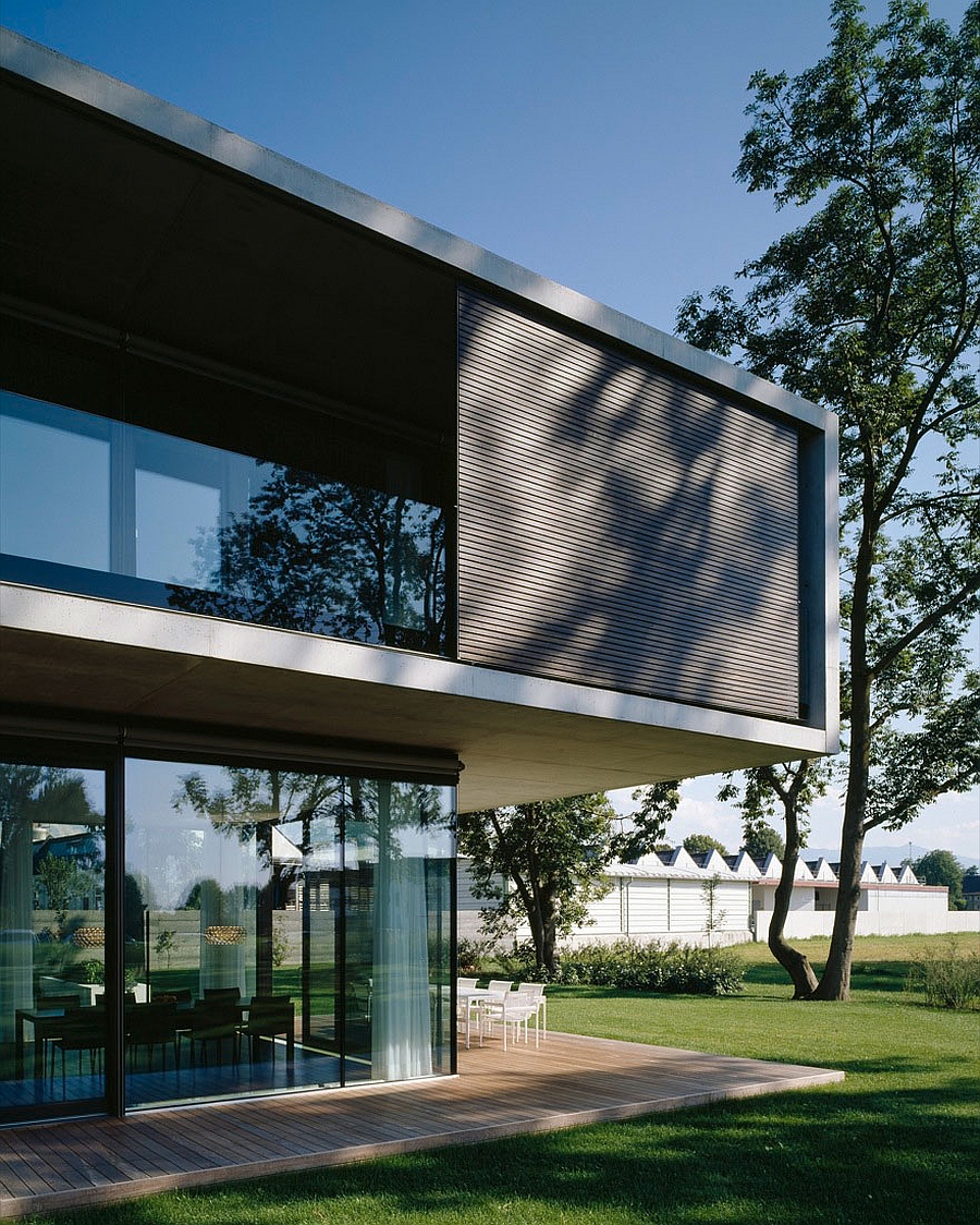 Wooden slats coupled with glass offer both privacy and ventilation