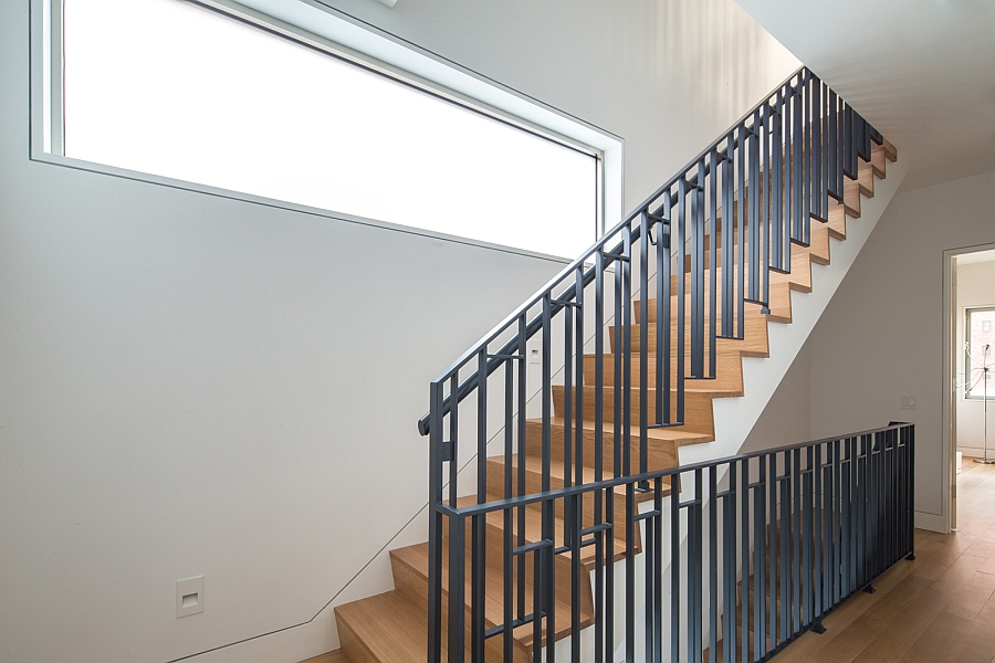 Wooden staircase with steel railing