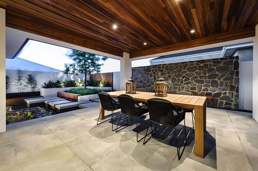 A lovely reflecting pond and outdoor sitting space of the Perth house