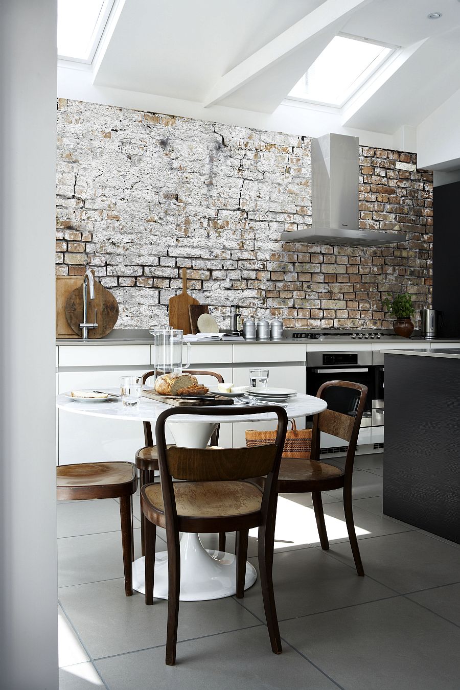 Aged brick wall wallpaper in the kitchen combines two hot design trends!