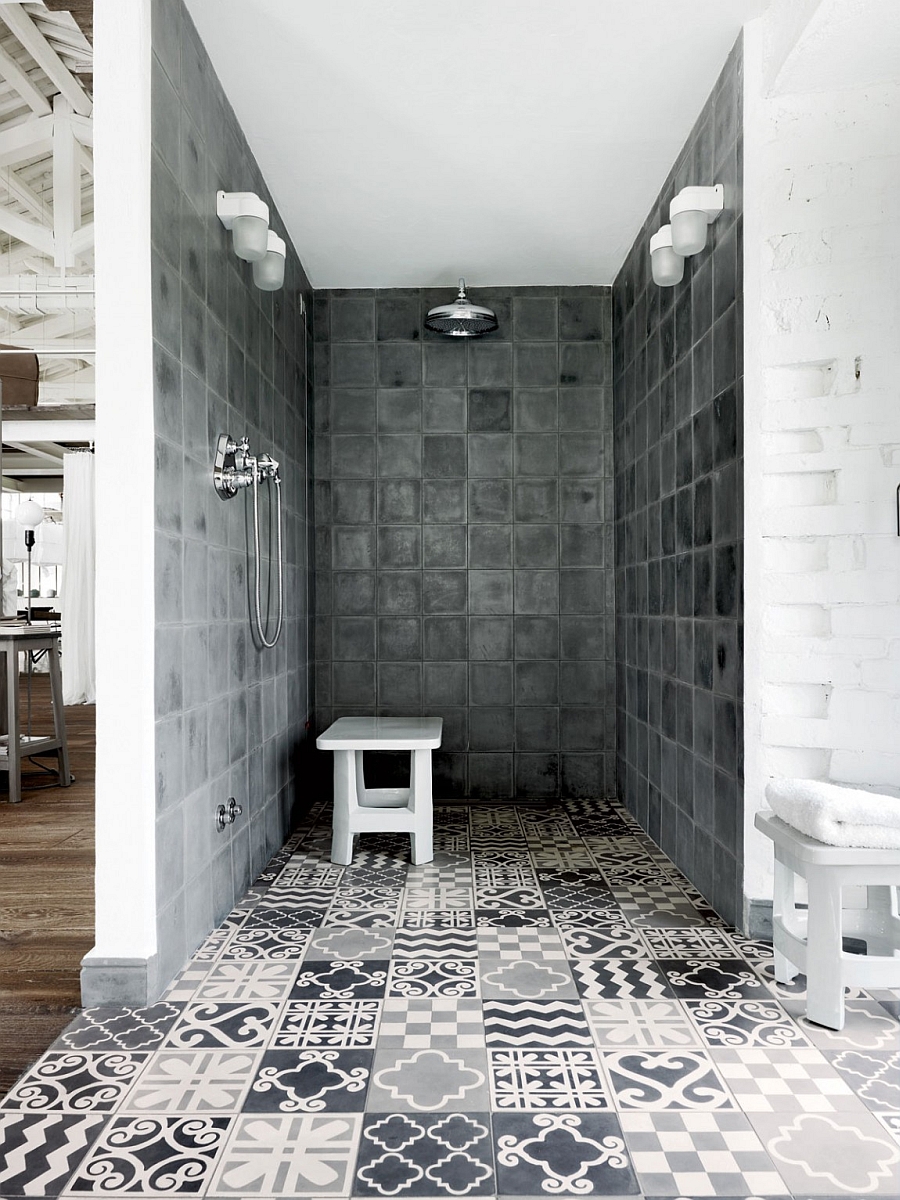 Amazing use of tiles in different patterns of white and grey in the stunning shower area