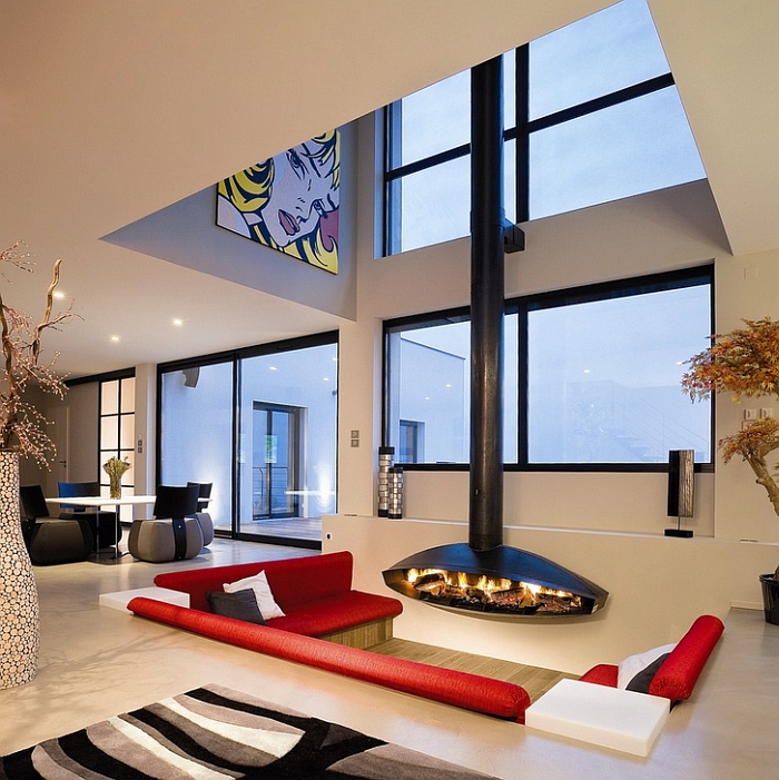 Antefocus fireplace enlivens this cool and elegant sunken lounge