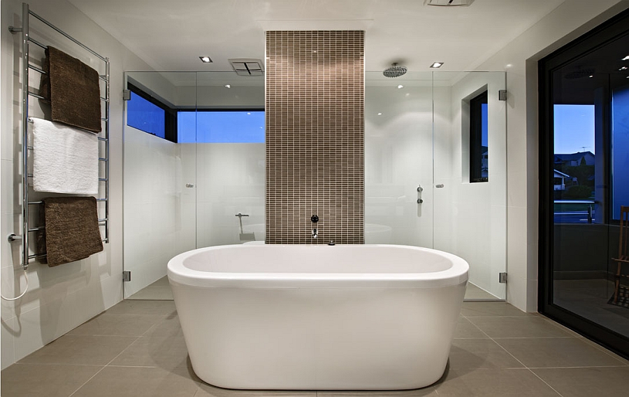 Beautiful contemporary bath with a standalone tub and a smart shower area in the backdrop