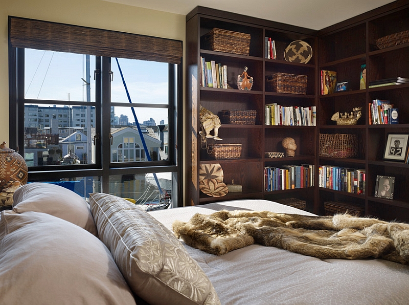 Beautiful corner bookshelf in the bedroom doubles as a wonderful display