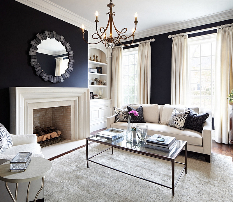 Black walls add a sense of coziness and grandeur to the living room