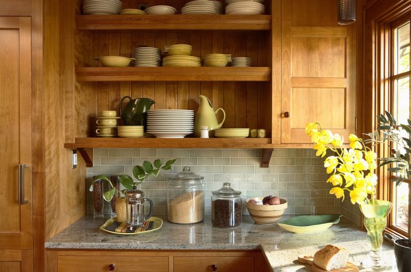 Blossoms, plants and produce in a warm-toned kitchen