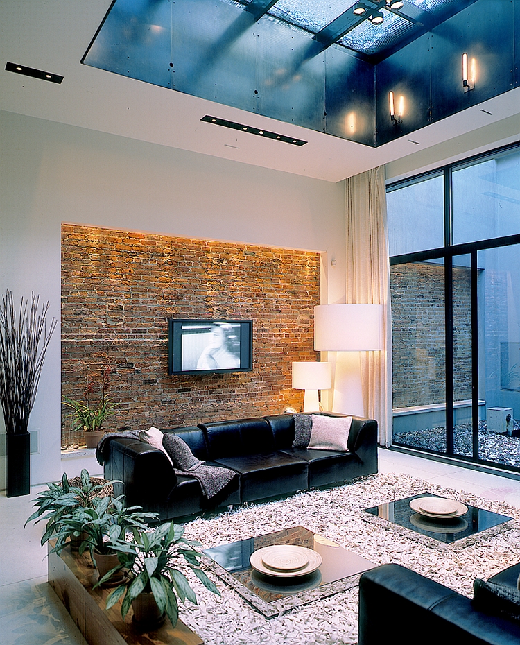 Brick accent wall in the living space gives the room a unique look