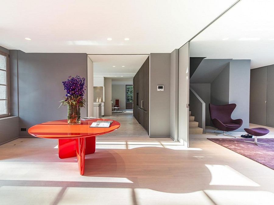 Bright pops of orange and purple enliven the lavish ground level of the villa