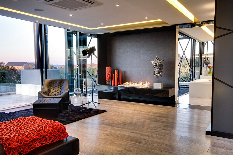 Bright red accents bring visual appeal to the posh bedroom