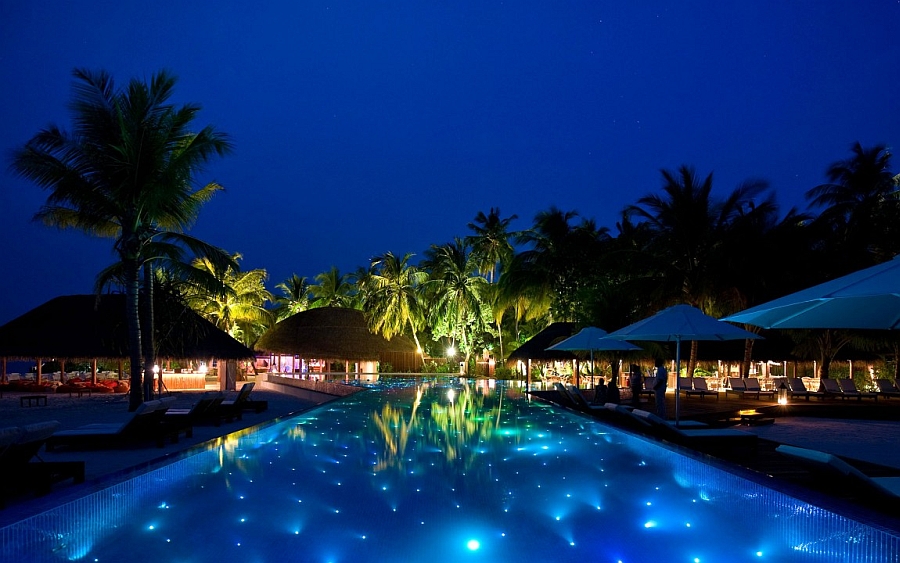 Brilliant LED lighting in the pool mimics the night sky as you rest next to the ocean