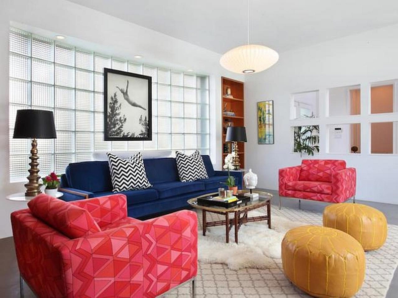 Combine trendy chevrom patterns with colorful ottomans in the living room