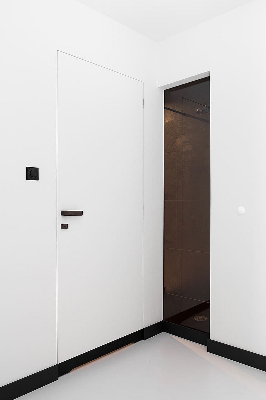 Contemporary bath area that is mainly clad in pristine white