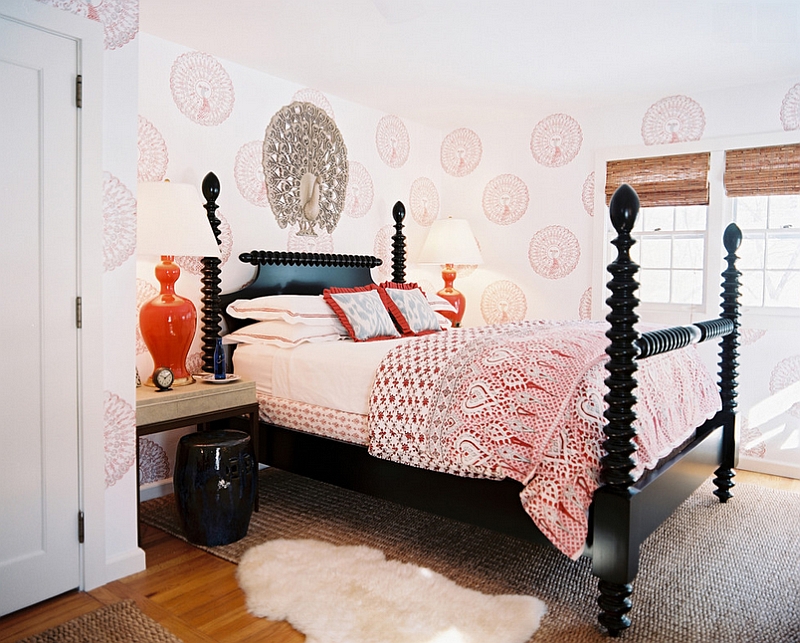 Contemporary bedroom with bright pops of orange