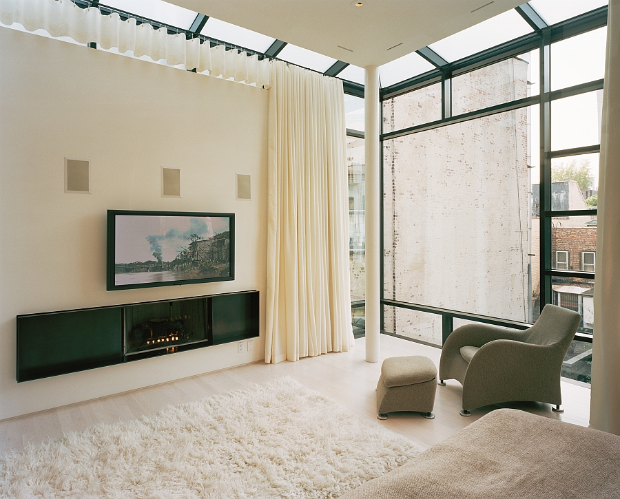 Cozy bedroom in light cream with drapes that usher in privacy