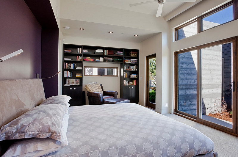 Eggplant accent wall enlivens the bedroom in neutral hue