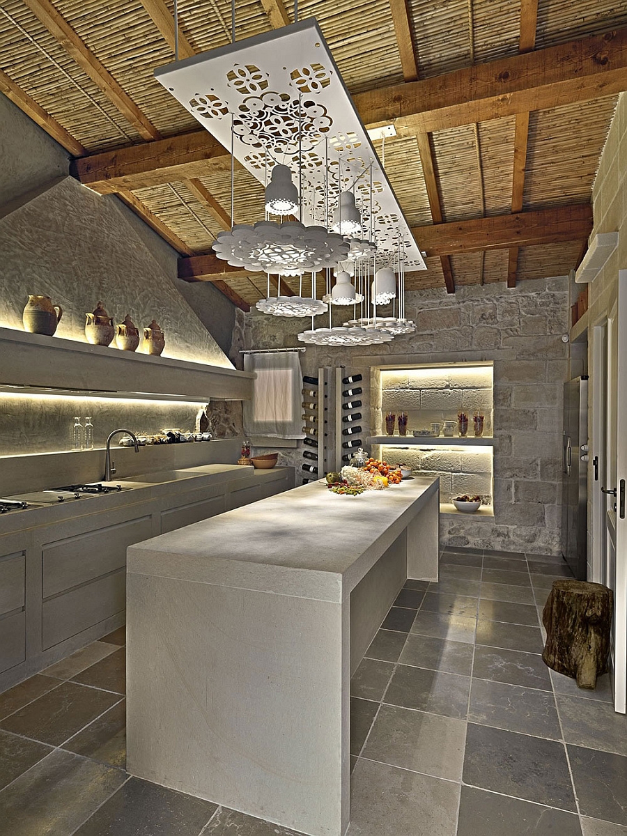 Elegant kitchen with an intoxicating wine collection and sculptural lighting