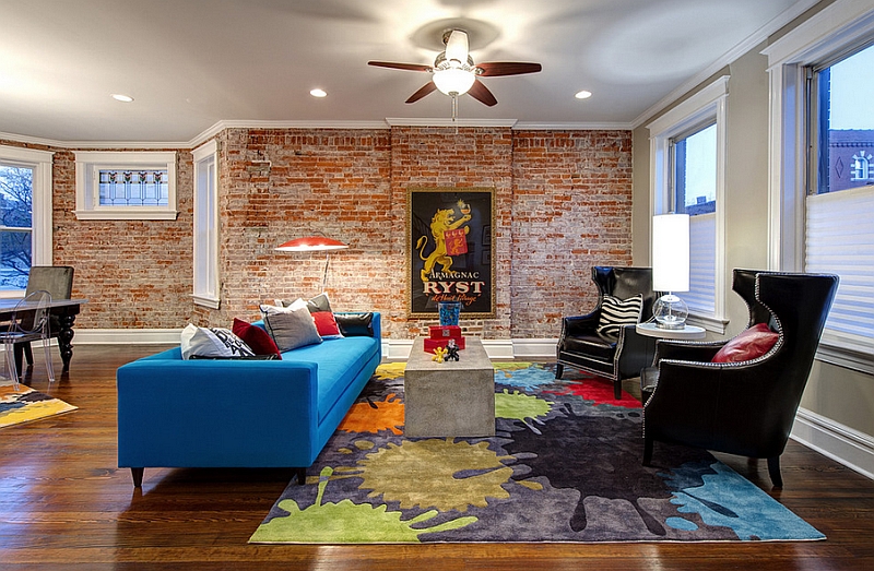 Exposed brick walls bring a touch of historic charm to the living room