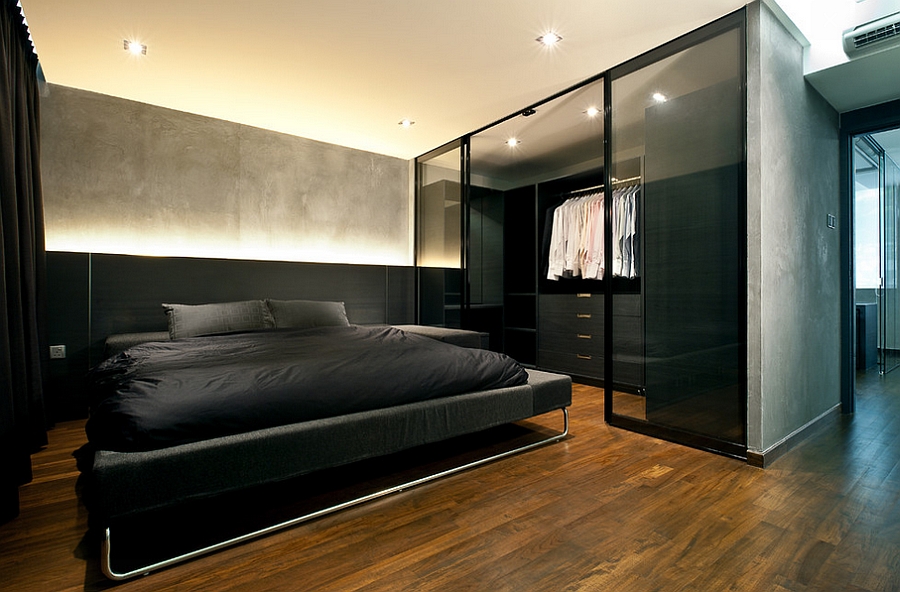 Exposed concrete walls and the glass enclosure for the dressing room steal the show here