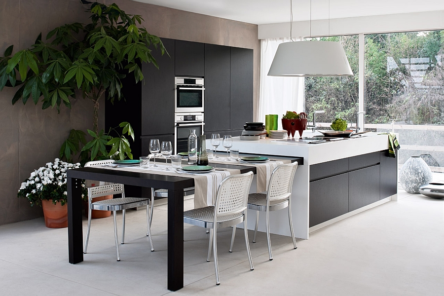 Extendable dining table that can be tucked away into the kitchen island