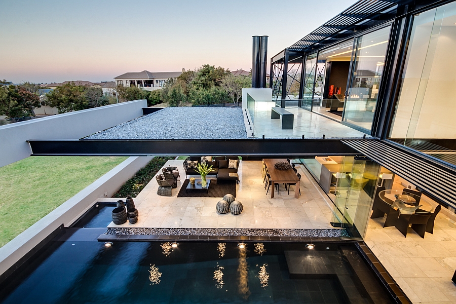 Extended balcony of the bedroom offers shade for the patio beneath