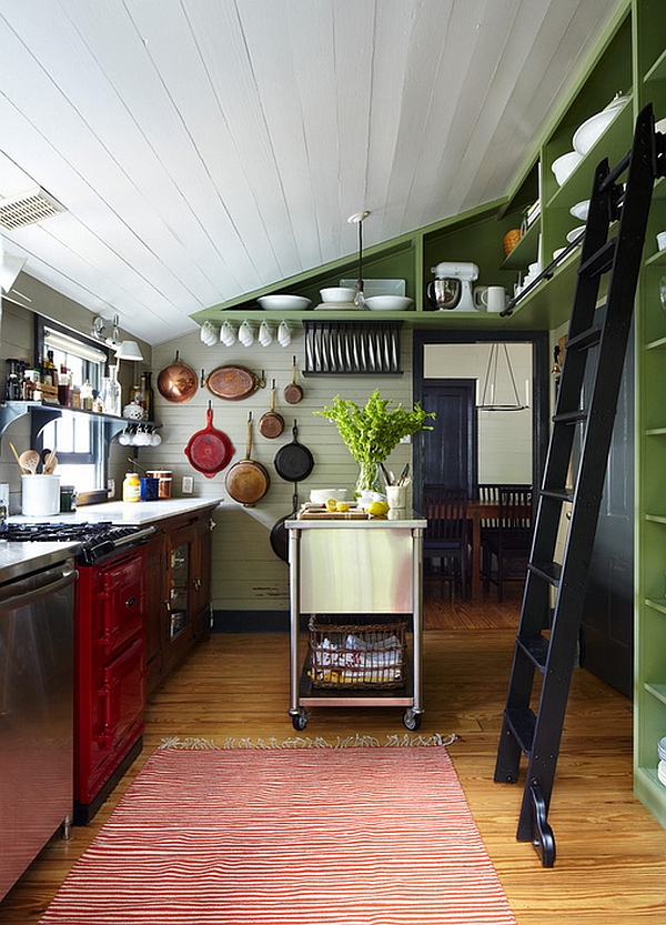 Farmhouse kitchen with sloped roof, ladder and kitchen island on wheels