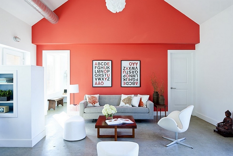 Farmhouse style living room with a bright coral accent wall and iconic decor