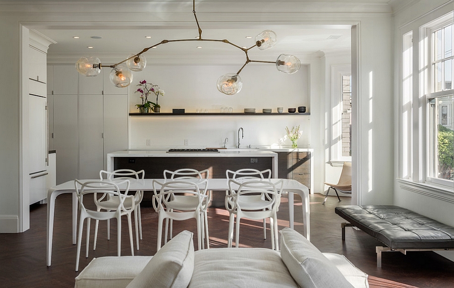 Fascinating Masters Chairs and lighting bring uniqueness to the trendy dining room