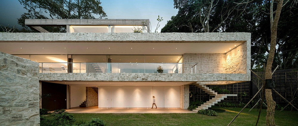 Front facade of the home beautifully lit at dusk