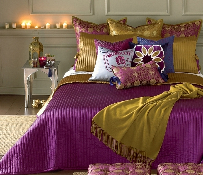 Gold and purple create a plush and sophisticated ambiance in the bedroom