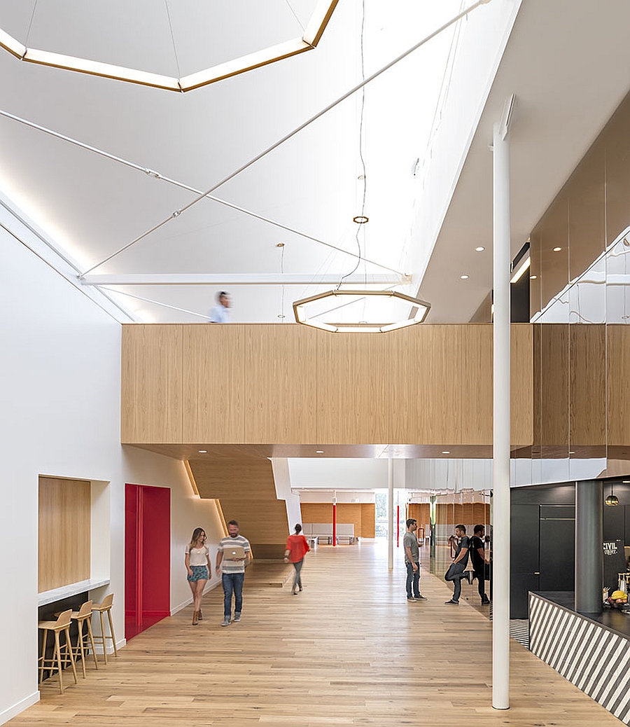 Goregous lighting and walls draped in wood ushers in style into the new Beat Headquarters