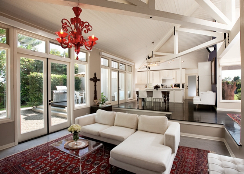 Gorgeous Murano red glass chandelier enlivens the bright and airy living room