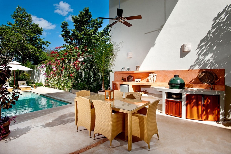 Gorgeous outdoor dining area and kitchen next to the pool